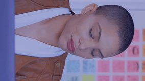 Animation of network of digital icons against woman using laptop at office. Global networking and business technology concept - Powered by Shutterstock - Get 15% off with code: PIKWIZARD15