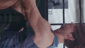 Animation of financial data processing over caucasian couple exercising on gym. Sports, active lifestyle, finances and digital interface concept digitally generated video. - Powered by Shutterstock - Get 15% off with code: PIKWIZARD15