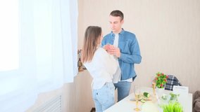 Love couple hugging cooking a meal together in the kitchen at home - Powered by Shutterstock - Get 15% off with code: PIKWIZARD15