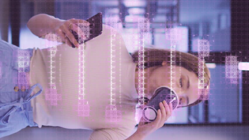 Animation of dna strand spinning over asian businesswoman using smartphone in office. global research, business, connections and data processing concept digitally generated video. - Powered by Shutterstock - Get 15% off with code: PIKWIZARD15