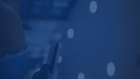 Animation of digital icons against over mid section of african american woman using smartphone. Global networking and business technology concept - Powered by Shutterstock - Get 15% off with code: PIKWIZARD15