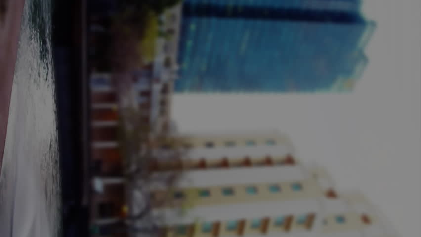 Animation of social media icons and stock market data processing against tall buildings. Social media networking and business data technology concept - Powered by Shutterstock - Get 15% off with code: PIKWIZARD15