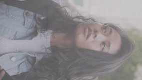 Animation of financial data processing over confused asian woman using smartphone on the street. Global finance and business technology concept - Powered by Shutterstock - Get 15% off with code: PIKWIZARD15