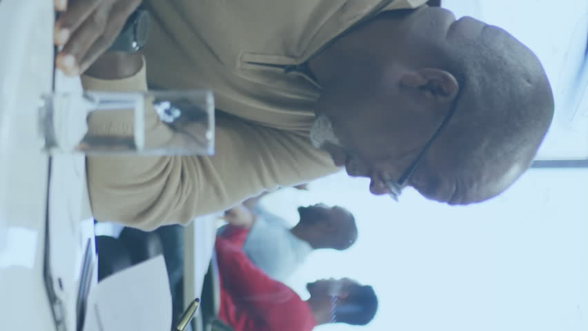 Animation of statistical data processing against diverse man and woman discussing at office. Computer interface and business data technology concept - Powered by Shutterstock - Get 15% off with code: PIKWIZARD15