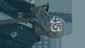 Animation of numbers and data processing over caucasian man using smartphone. Global connections, computing, digital interface and data processing concept digitally generated video. - Powered by Shutterstock - Get 15% off with code: PIKWIZARD15