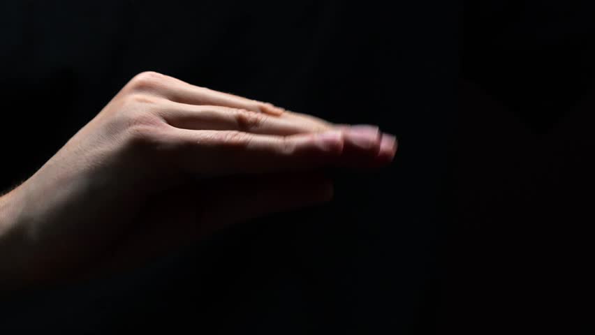 Hand gesture blah blah on a black background. Gesture of disrespect and conflict.
Empty promises and lies.
Male hand imitates conversations without actions.
Empty words and lies.