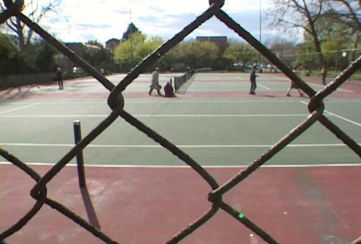 People play tennis at park in Portland in time lapse.