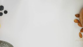 Super foods text animation over various healthy ingredients on white background. Nutrition, dieting, wellness, clean eating, organic, antioxidants - Powered by Shutterstock - Get 15% off with code: PIKWIZARD15