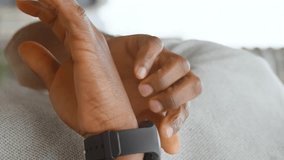 Animation of social media icons with numbers over african american man using smartwatch. Global communication, social media, connections and digital interface concept digitally generated video. - Powered by Shutterstock - Get 15% off with code: PIKWIZARD15