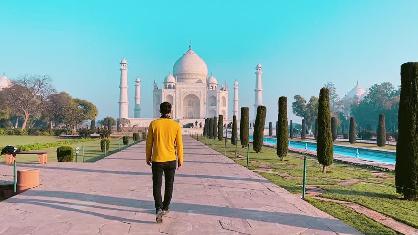 Tourist exploring the majestic Taj Mahal in Agra, India – a timeless monument of love and beauty with stunning Mughal architecture. 