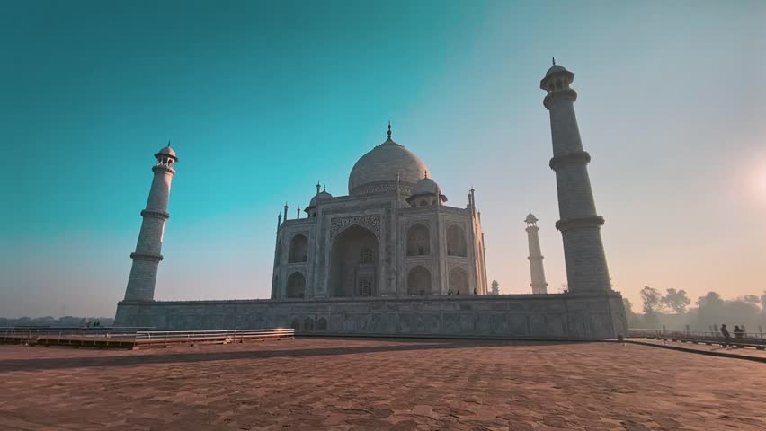 Taj Mahal at sunrise in Agra, India. Majestic Mughal-era monument of love in soft morning light, a global icon and top travel destination.