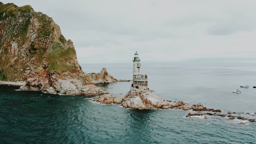 An abandoned old lighthouse on the cliffs by the sea. Beautiful places on the planet. Sakhalin.