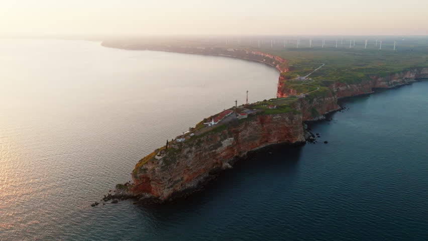 Stunning aerial shot of Cape Kaliakra Bulgaria shows dramatic cliffs Black Sea panoramic landscape rocky shoreline summer nature destination travel beauty green terrain history ruins drone 