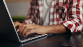 Close-up of male programmer typing on laptop, focused on a freelance project - Powered by Shutterstock - Get 15% off with code: PIKWIZARD15