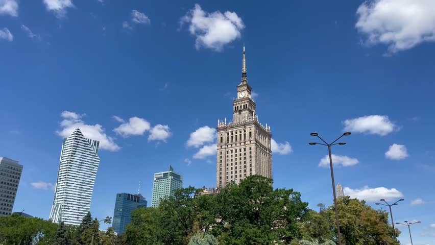 Palace of Culture and Science dominates Warsaw cityscape under clear sky historic landmark with monumental architecture symbol of Polish heritage and urban pride