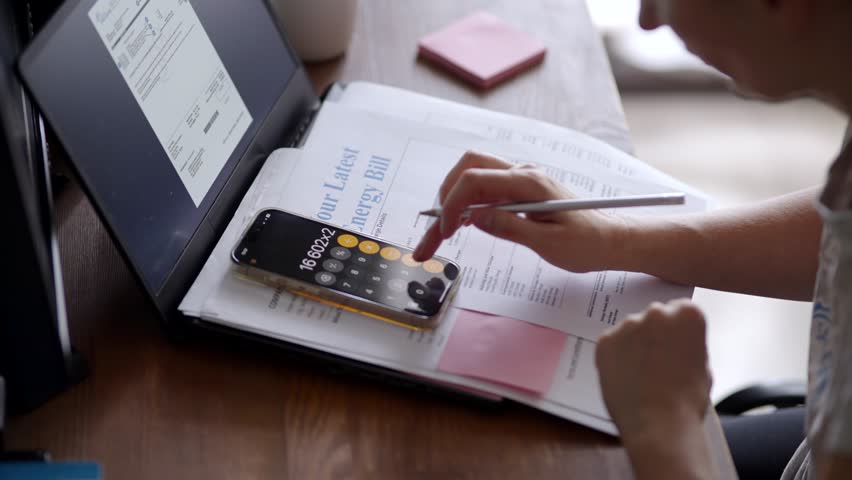 Calculating Finances With Calculator App Paying Energy Bills And Checking Expenses. Budgeting At Home, Financial Planning. Managing Household Bills. Monthly Accounting. Personal Economy Paying Taxes