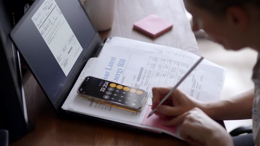 Calculating Finances With Calculator App Paying Energy Bills And Checking Expenses. Budgeting At Home, Financial Planning. Managing Household Bills. Monthly Accounting. Personal Economy Paying Taxes
