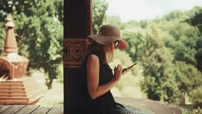 Woman Using Smartphone Outdoors. Tourist Checking Phone Social Media Communication. Technology And Travel Summer Vacation Leisure. Mobile Phone Interaction Online Engagement. Mindful Wellness Retreat - Powered by Shutterstock - Get 15% off with code: PIKWIZARD15