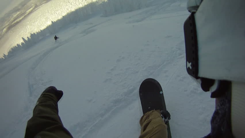 Snowboarding Backcountry In Deep Powder Snow