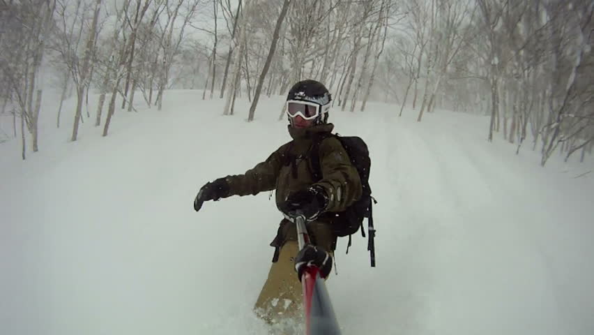 Extreme Snowboarder Blasts Through Powder Snow Wipe Out. Snow flies everywhere