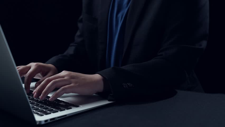 A professional hands typing on a laptop with visual representations of cybersecurity elements, illustrating the importance of secure data protection in a digital environment. Qubit - Powered by Shutterstock - Get 15% off with code: PIKWIZARD15