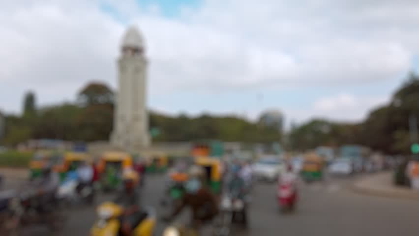 Bokeh view of road traffic on the streets of Bangalore, India. Blurred background footage.