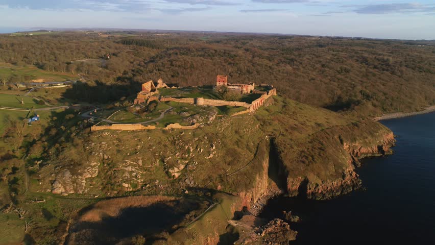 Aerial footage of northern Europe’s biggest castle ruin, Hammershus on the island Bornholm in Denmark. Hammershus dates back to the middle age. The ruin is placed on a cliff overlooking the Baltic sea