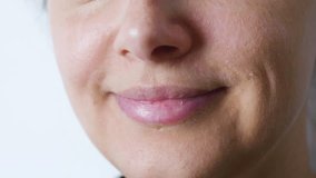 Close up of a woman taking a large bite of a red velvet cookie with white chocolate chips and a black cocoa biscuit base, highlighting the indulgence and enjoyment of sweet treats - Powered by Shutterstock - Get 15% off with code: PIKWIZARD15