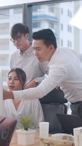 Vertical Screen : Collaborative of multicultural businesspeople using computer presentation and communication meeting brainstorming ideas about project colleagues work plan success strategy in office.