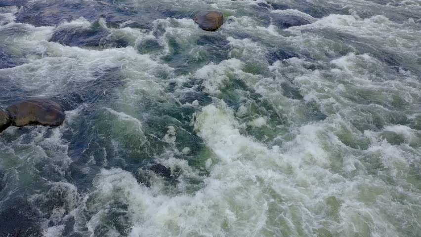 Rapids on the Saluda River by the Riverwalk in Columbia SC partly cloudy