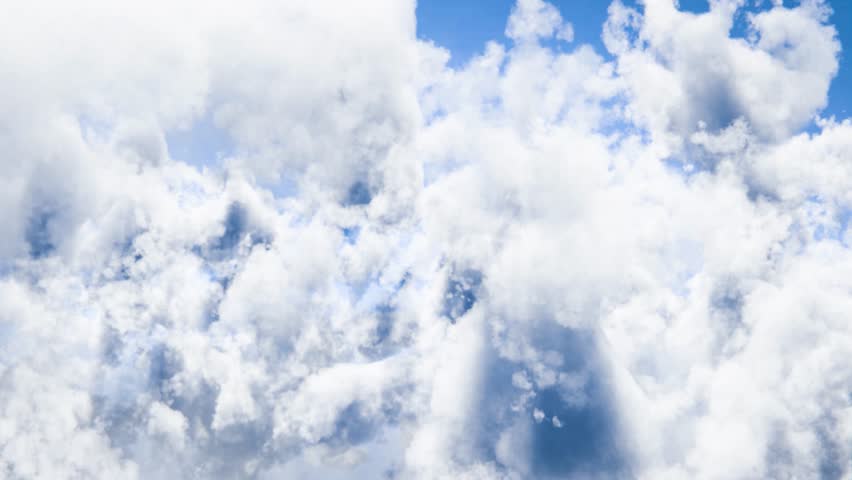 White clouds moving across a deep blue sky, creating a peaceful looping journey.