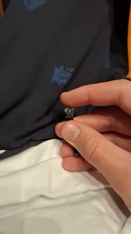 A small igniter from a lighter, held in hand.