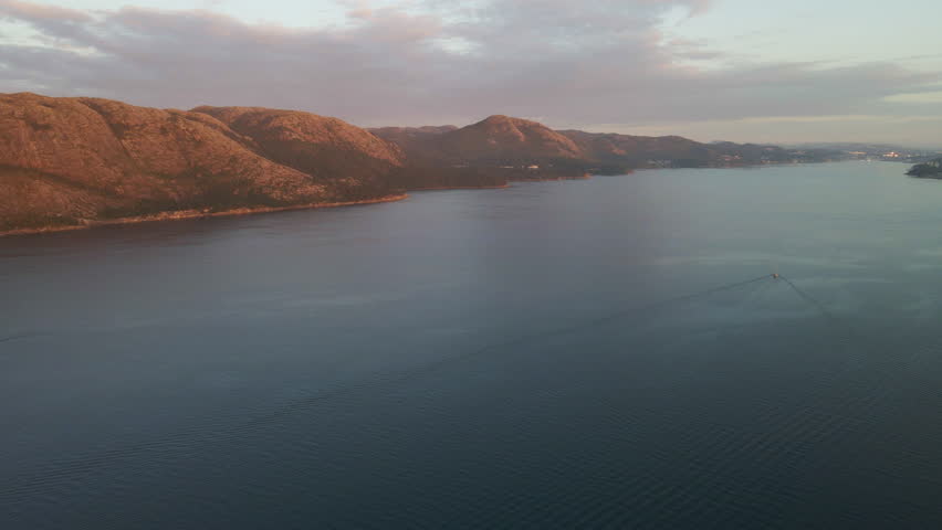 Aerial Drone Shot Over a Norwegian Fjord at Dusk

