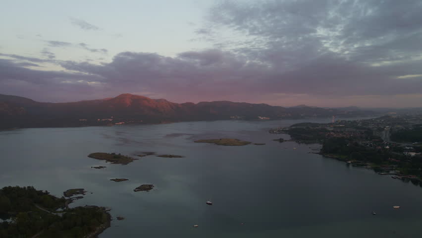 Aerial Drone Shot Over a Norwegian Fjord at Dusk

