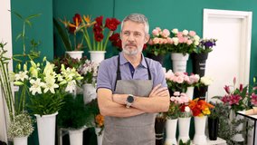 Professional florist working confidently, surrounded by vibrant blossoms showcasing deep horticultural knowledge and artistic floral arrangement skills - Powered by Shutterstock - Get 15% off with code: PIKWIZARD15