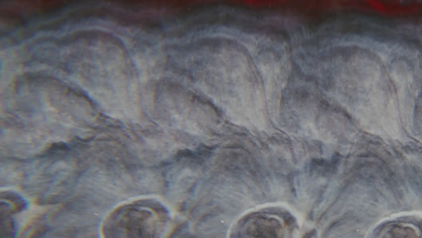 Blur glitter spill. Prism fluid. Colorful shimmering fragmented liquid leak pattern abstract background. Red brown gray paint mix.