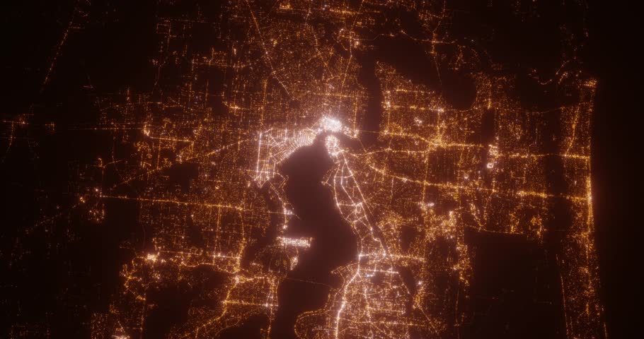 Jacksonville (Florida, USA) aerial view at night. Top view on modern city with street lights. Camera is zooming out, rotating clockwise
