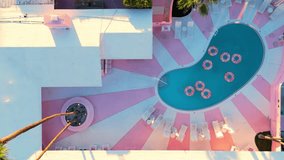 Aerial Pullback From Retro Hotel Pool With Colorful Floaties - Powered by Shutterstock - Get 15% off with code: PIKWIZARD15