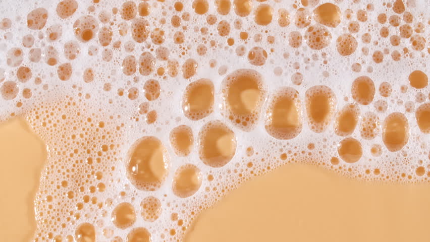 Texture of white soap foam with bubbles abstract background. Soap sud macro structure. Bathtup Soap Foam. Natural White Shampoo Bubbles Motion.