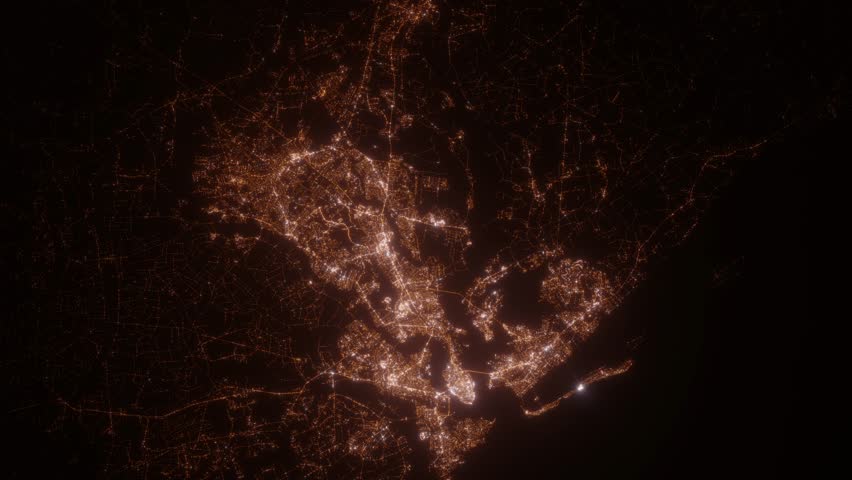 Charleston (South Carolina, USA) aerial view at night. Top view on modern city with street lights. Camera is flying above the city, moving backward