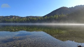 Morning fog over a beautiful mountain lake adds mysticism - Powered by Shutterstock - Get 15% off with code: PIKWIZARD15