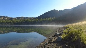 The shore of the crater lake on a beautiful summer morning creates a good mood for travelers. - Powered by Shutterstock - Get 15% off with code: PIKWIZARD15