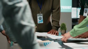 Diverse business team exchanging insights and forecasting diagrams in a late night meeting, reviewing financial data analytics and business intel. Advisory board collaboration. Camera B. - Powered by Shutterstock - Get 15% off with code: PIKWIZARD15