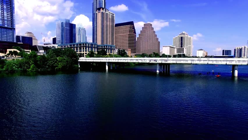Austin texas skyline over the river and bridge on a sunny day
