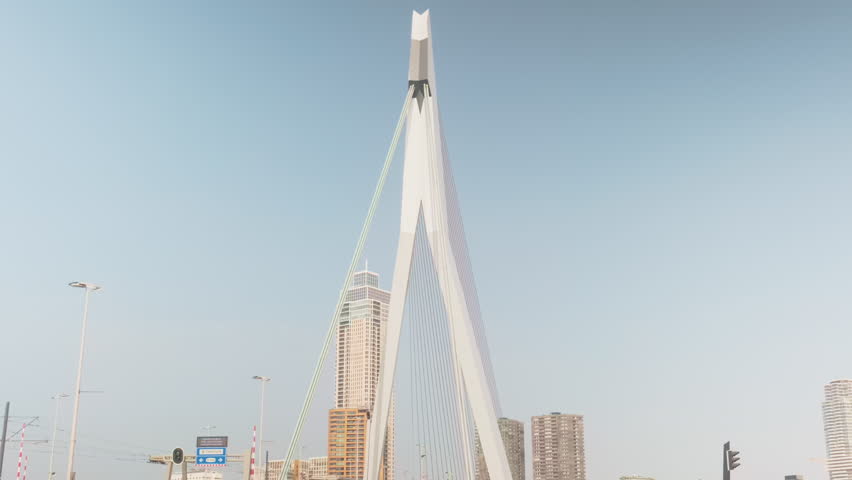 Erasmusbrug bridge AKA The Swan during the day with blue sky in Rotterdam, Netherlands, wide shot