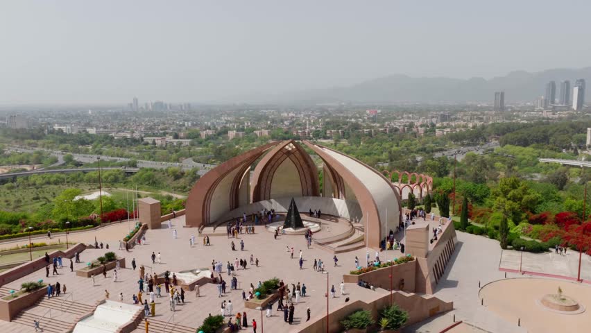 Aerial view of Faisal Mosque in Islamabad, Pakistan, showcasing its grand architecture and the surrounding natural beauty - More