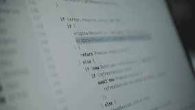 A close-up shot of a computer screen with lines of source code scrolling by quickly. A concept for programming, hacking, data streams, cyberspace, and modern technology - Powered by Shutterstock - Get 15% off with code: PIKWIZARD15
