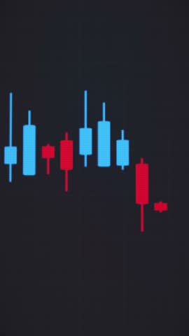 Vertical video animation of a moving candlestick chart in blue and red, showing how a price goes up and down, on a dark background, on a monitor. Volatility of investments (stock market, cryptocurrenc