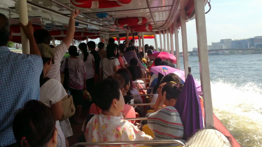 BANGKOK - 3 MAY: Locals and tourists are taking a Chao Phraya Boat express on
