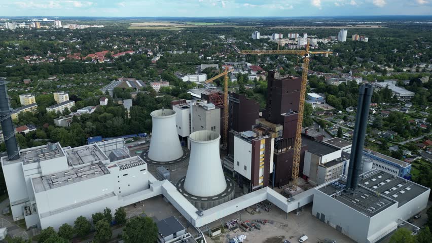 2 crane dismantling a power plant during a demolition process. Great aerial view flight drone top down Above view